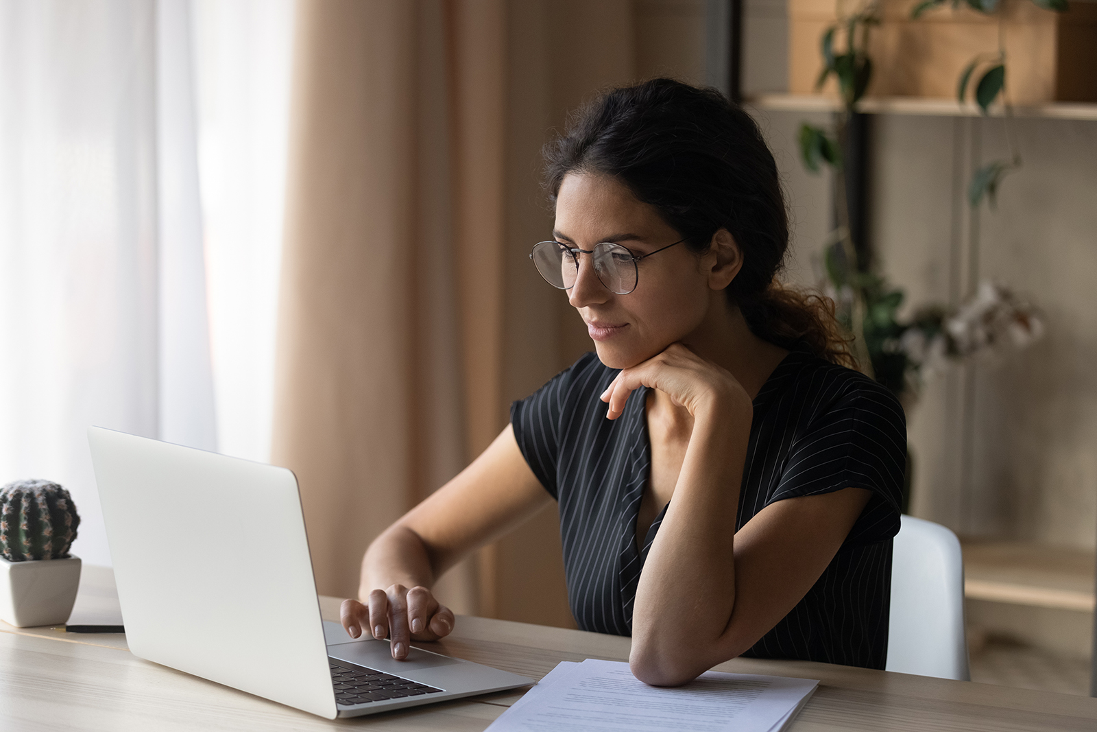 Latina woman working on laptop