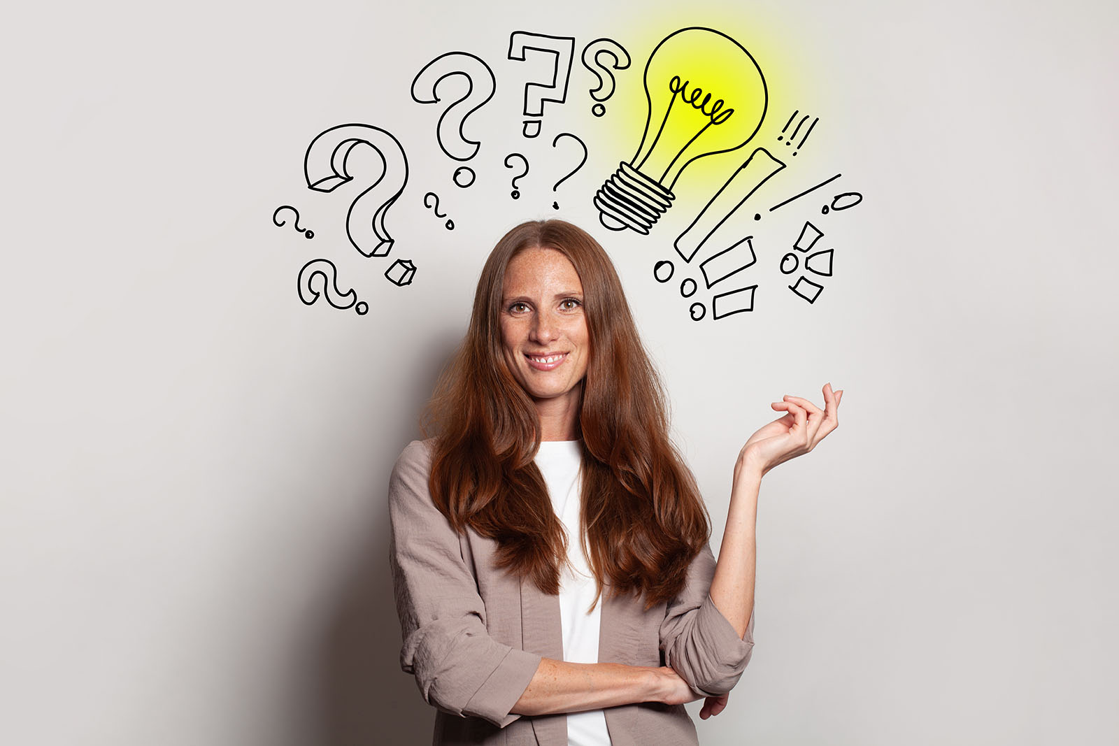 smiling woman with head surrounded by question marks, exclamation points and yellow light bulb