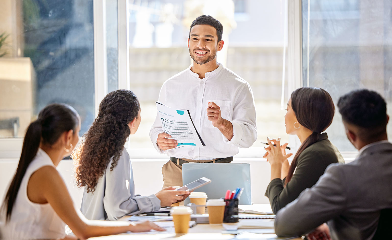 man training four people in office