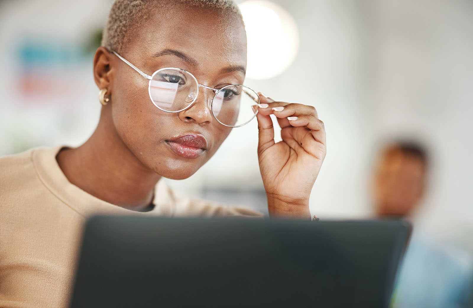 woman reading something on computer screen