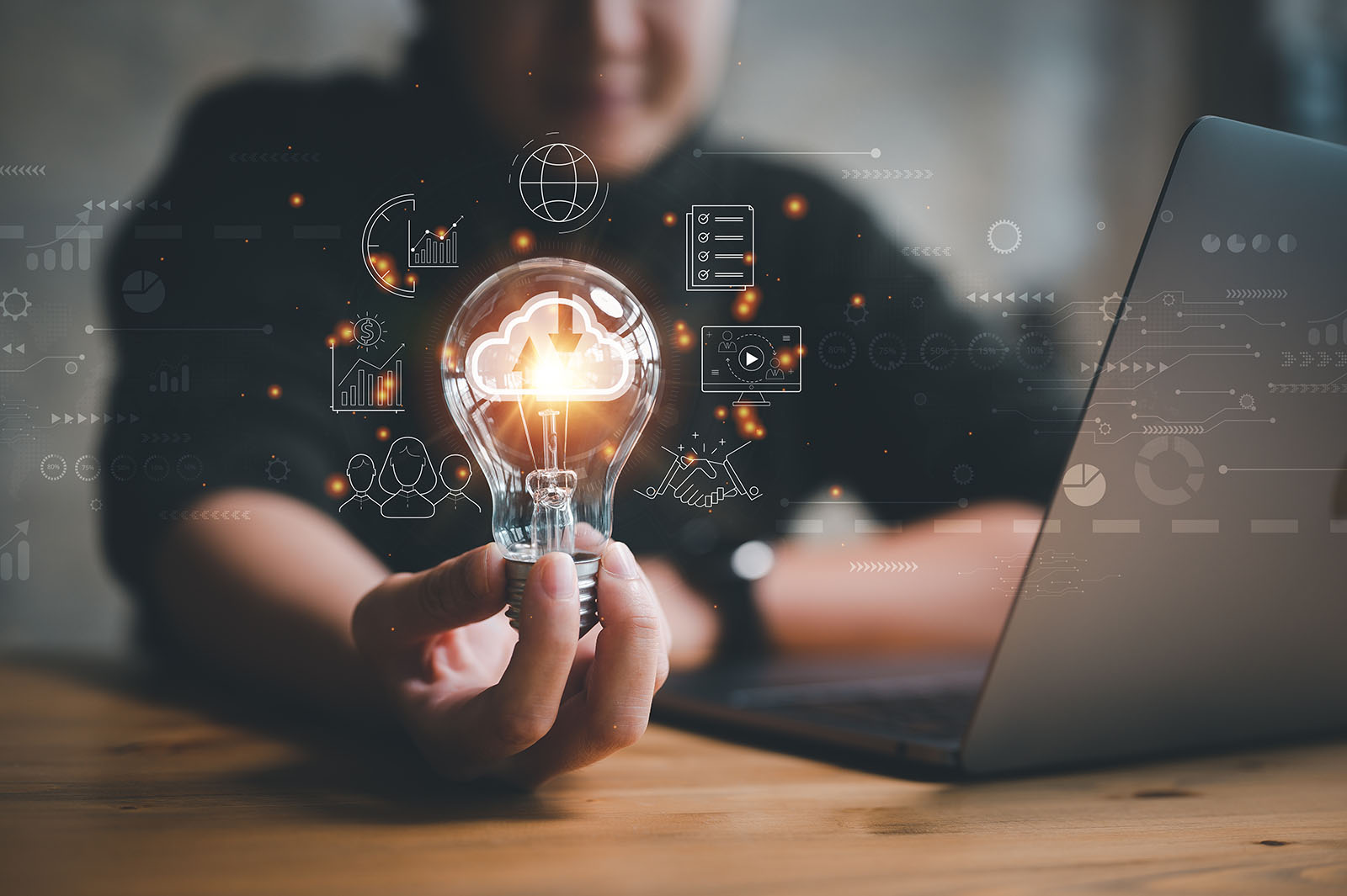 hand holding light bulb