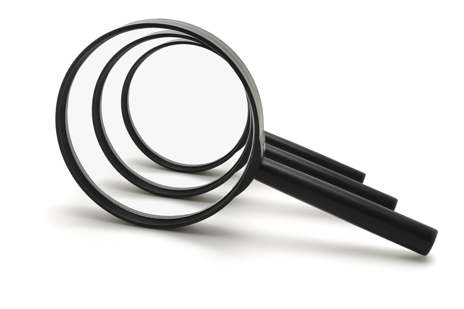 three magnifying glasses leaning on sides