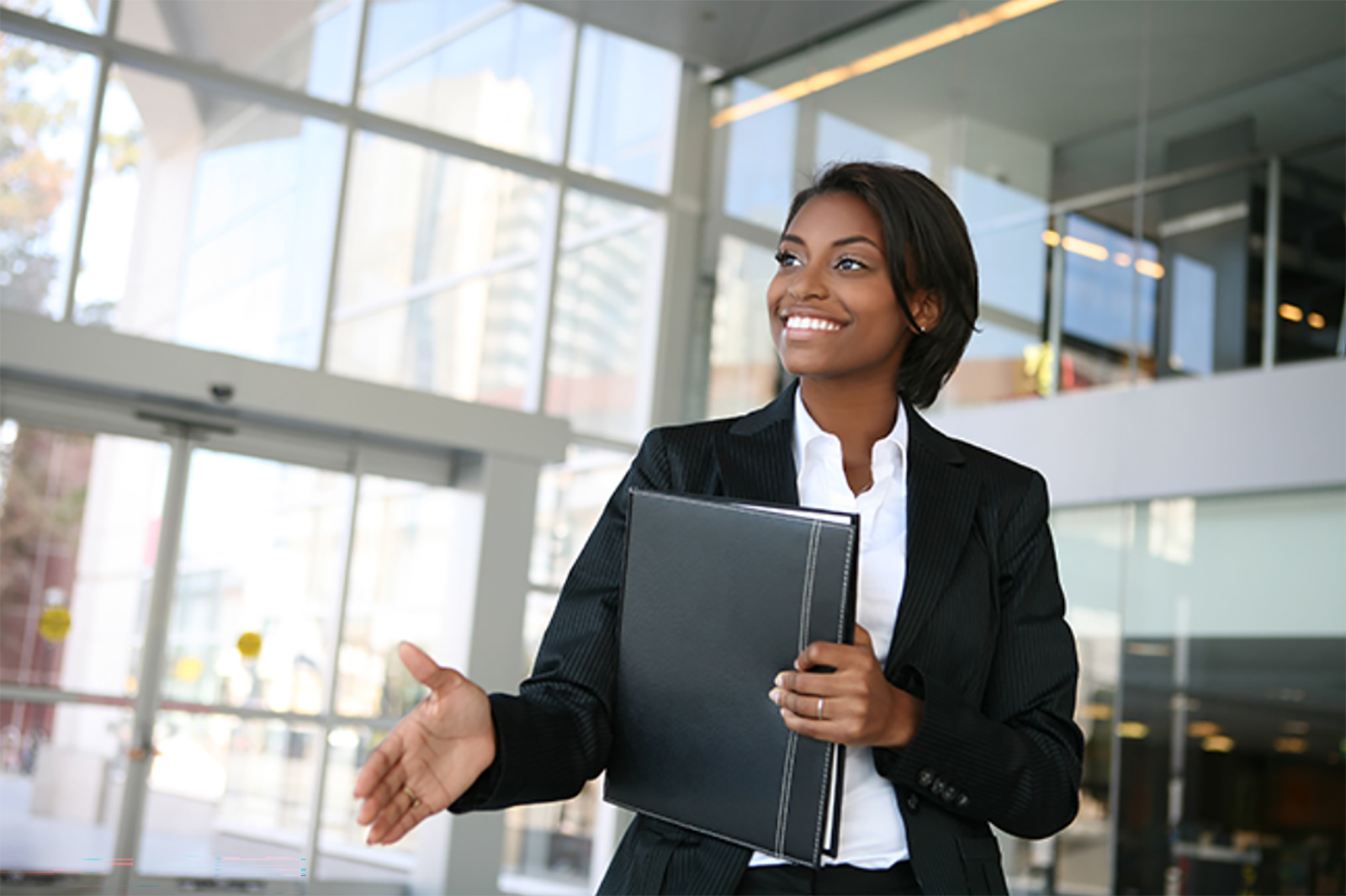 Smiling businesswoman offering a handshake