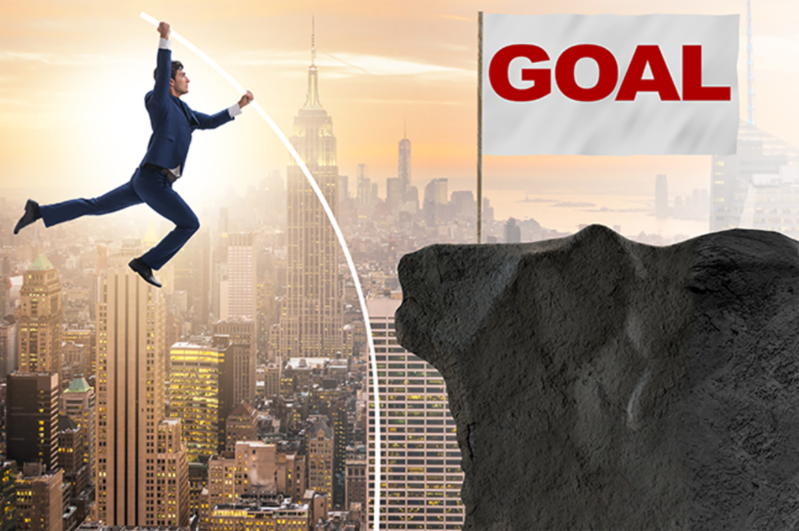 Businessman pole vaulting toward his goal