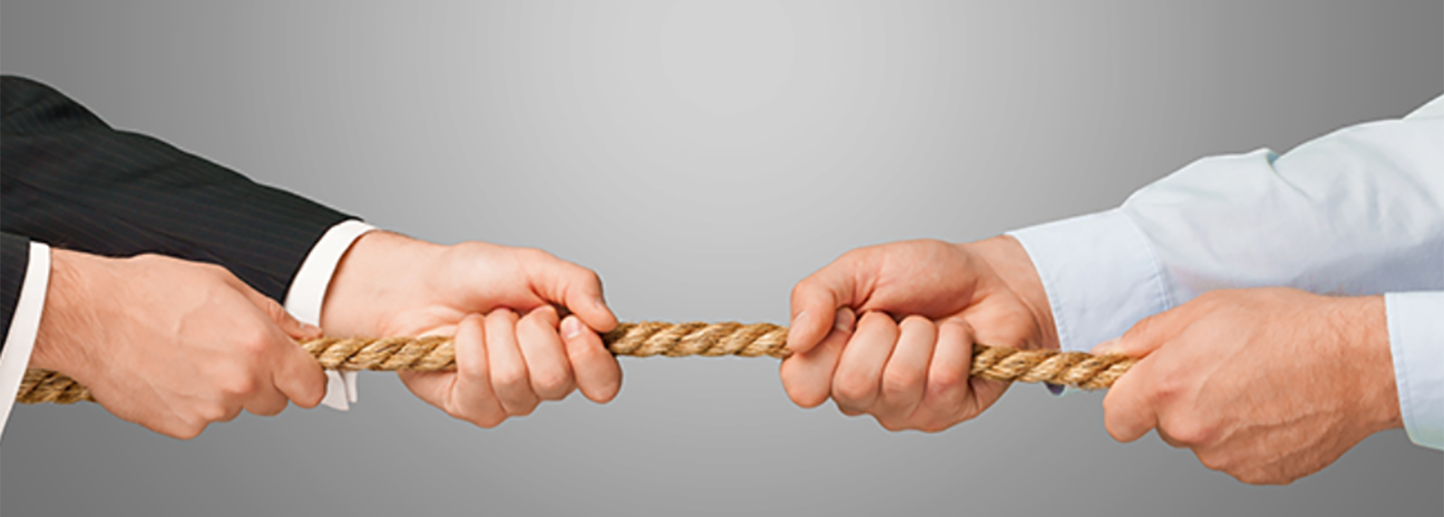 hands holding rope in tug of war