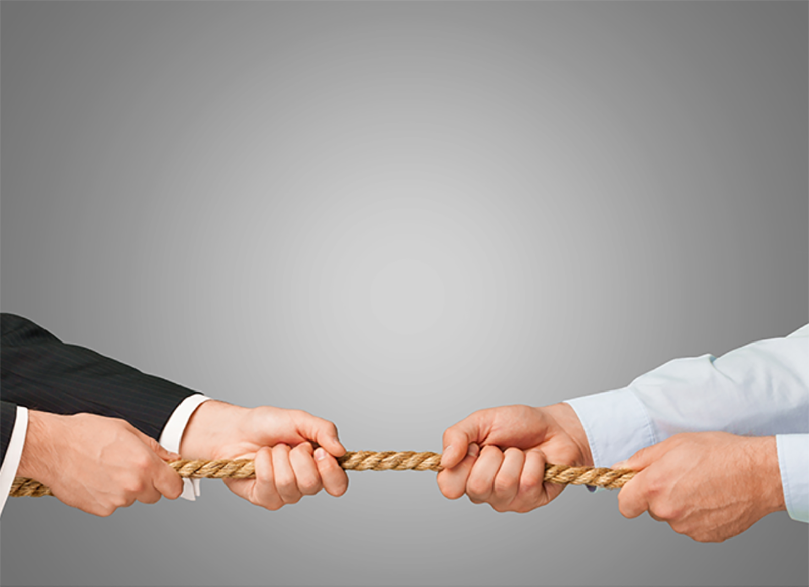 hands holding rope in tug of war